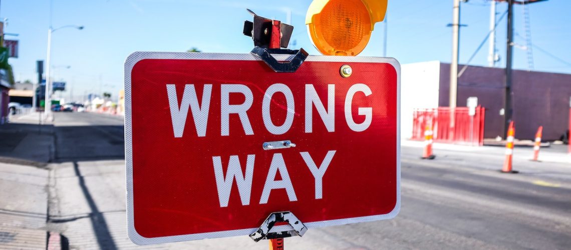 red Wrong Way signage on road